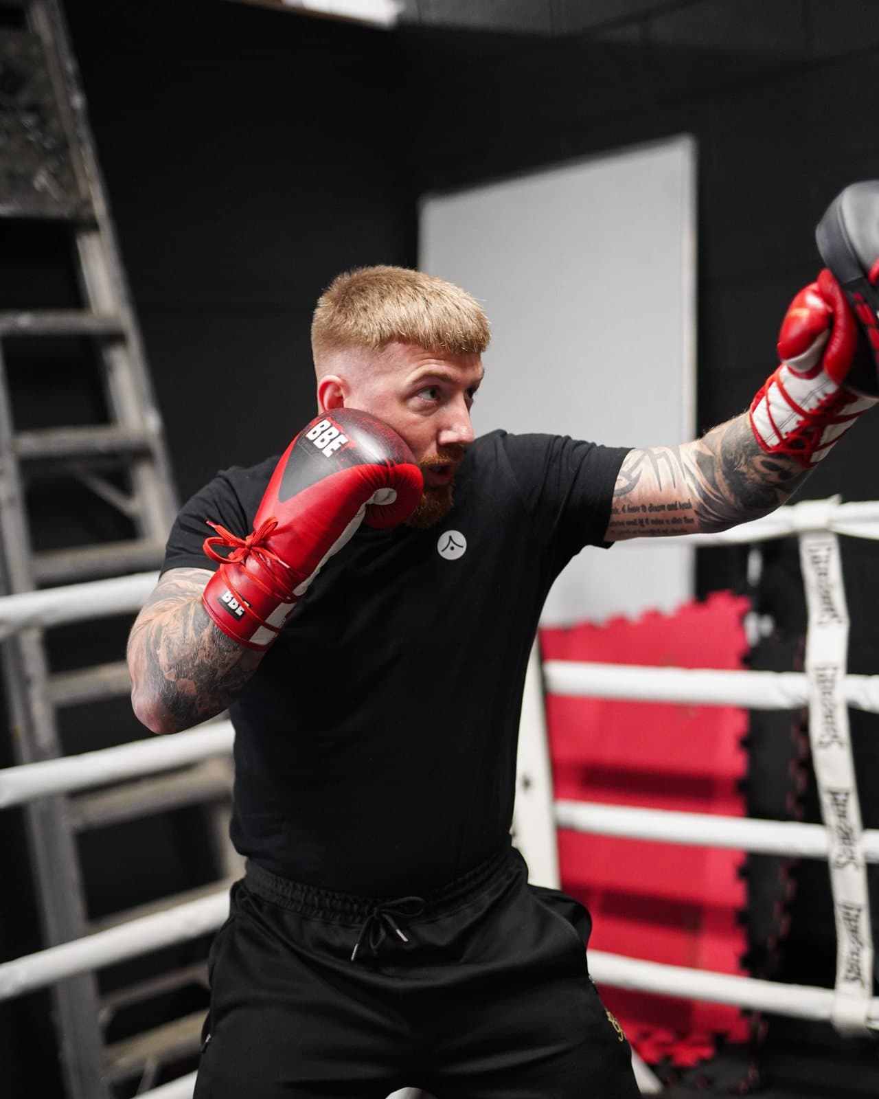 An adult boxer working the pads at Apex Martial Arts, Evesham