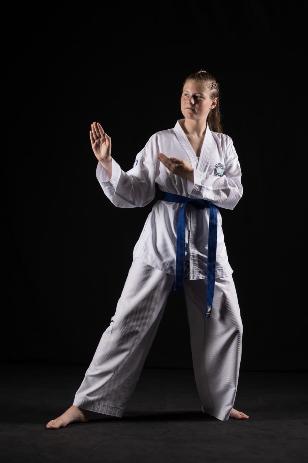 An adult Taekwon-Do student mid-technique at Apex Martial Arts, Evesham